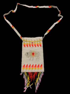 Guatemalan handcrafted glass bead shoulder bag, approximately 4” x 7” with a 32 inch strap.  The bags are decorated on both side